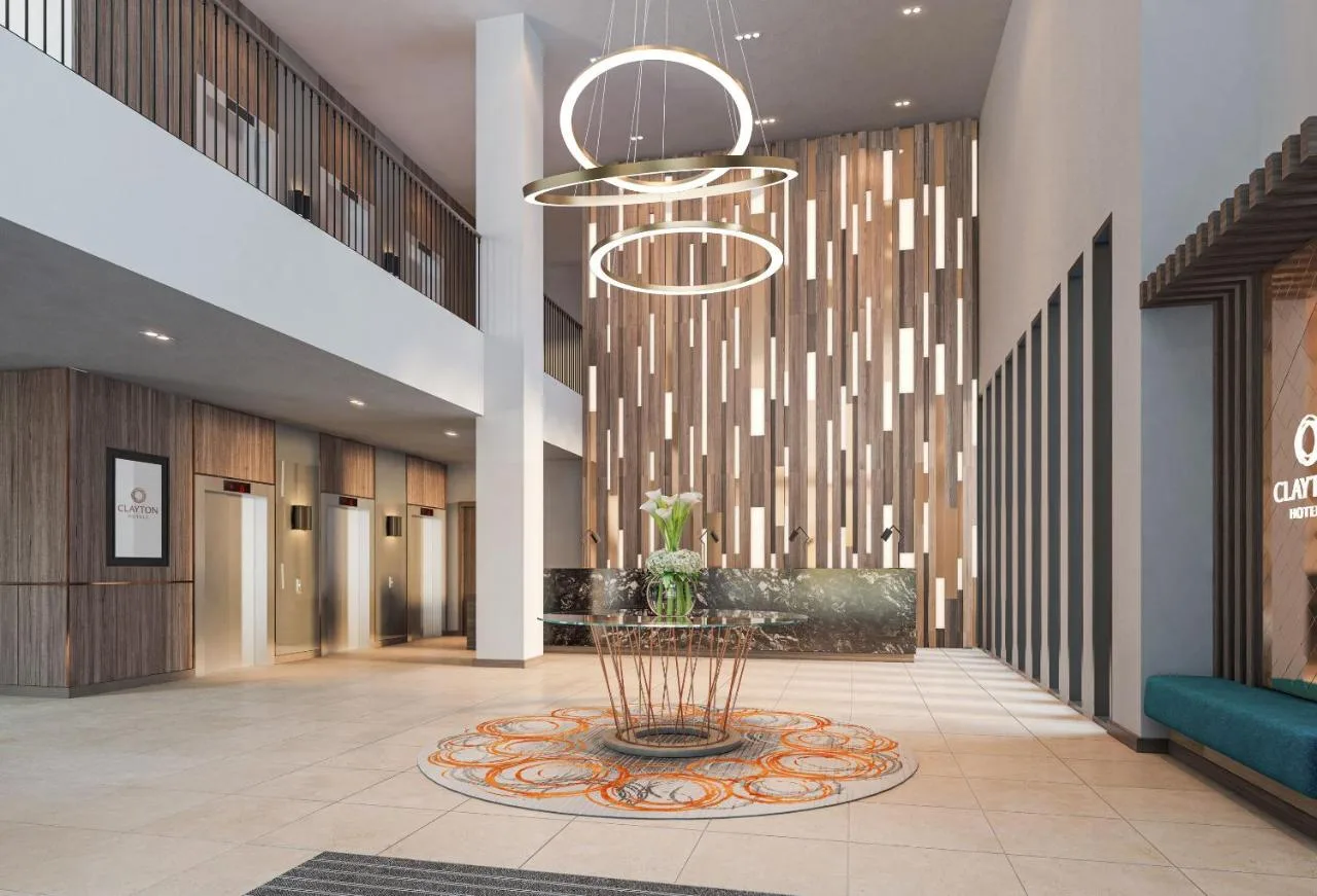 a lobby with a fountain in the middle of a building at Clayton Hotel Manchester City Centre in Manchester
